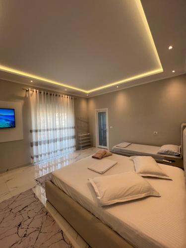 Rúm í herbergi á Guesthouse BellaVista
