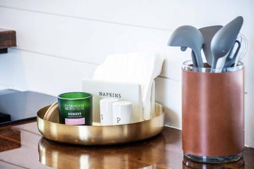 a metal container with utensils on a table at The Stardust Stunning Container Home in Alpine