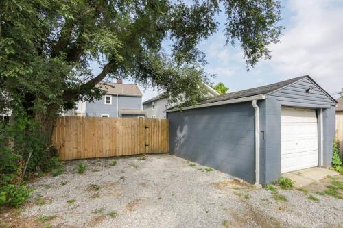 a garage in a yard next to a fence at 5th Street Retreat Private Home OSU, Short North in Columbus