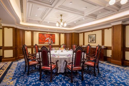 a dining room with a table and chairs at Shanghai Donghu Hotel - Shanghai Style Garden House in Shanghai