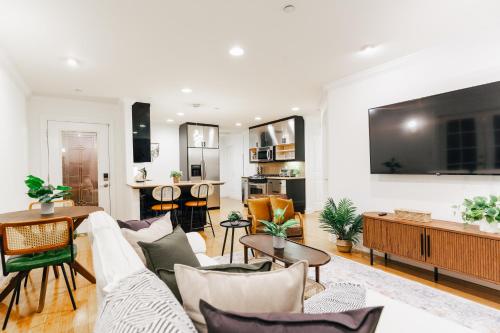 a living room with a couch and a table at Serene Escape 2BD Private Patio & Firepit near Stanford in Menlo Park