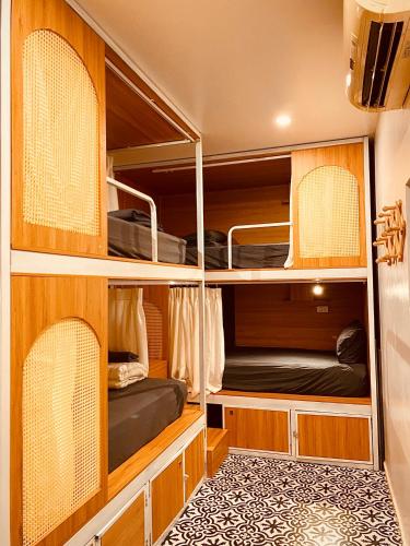 a bedroom with bunk beds in a room at Hoi An Wanderlust - Beachside in An Bang