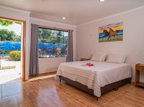 Cama ou camas em um quarto em Pousada e Restaurante Paraíso Natural