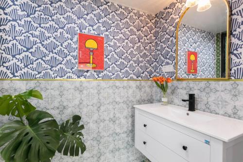 a bathroom with a sink and a mirror at 上海希之民宿 in Shanghai