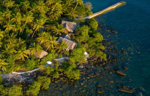 an aerial view of a tropical island with palm trees at Full Moon Island Resort in Kaoh Sdach