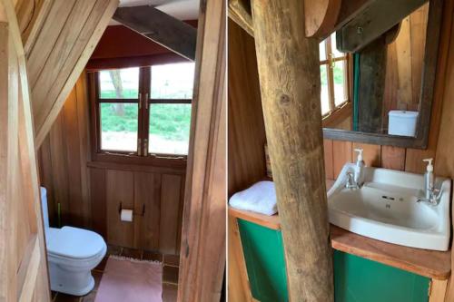 een badkamer met een wastafel en een toilet in een huis bij The Watch Tower 360' Bed View Shower Understars in Naivasha