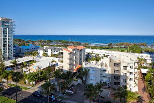 an aerial view of a building with the ocean in the background at Verve on Cotton Tree in Maroochydore