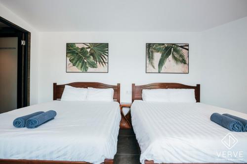 Giường trong phòng chung tại Ipoh Cozy 27 Pool Villa 6B5B 30 pax by Verve