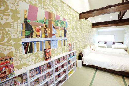 Postel nebo postele na pokoji v ubytování 雅宿Js204最大6名京橋駅から徒歩9分マンガとボードゲームが沢山