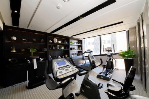a gym with two ellipticals and a treadmill at Boda Hotel in Taichung