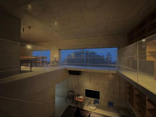 a large room with a large window in a building at SENSE Beppuwan in Hiji