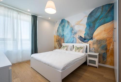 Ένα ή περισσότερα κρεβάτια σε δωμάτιο στο Luxury Apartment near Promenada, 1BR