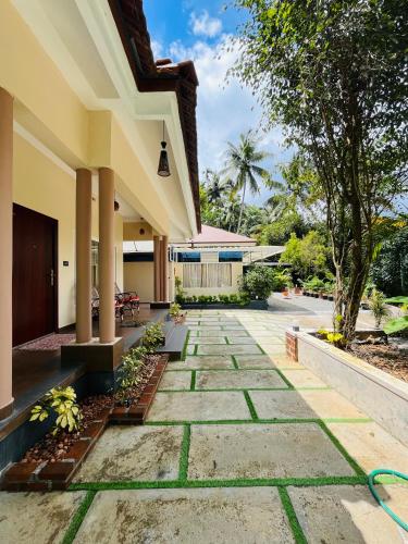 a walkway in front of a building at Fab Valley Homestay in Munnar