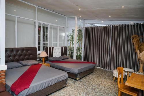 Ένα ή περισσότερα κρεβάτια σε δωμάτιο στο villa Ambarwati