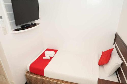 TV a/nebo společenská místnost v ubytování Ecoland 88 Apartelle & Suite