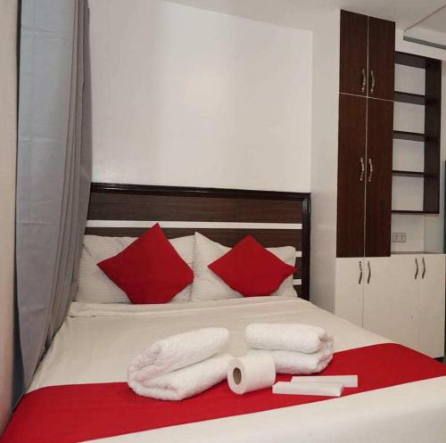 Postel nebo postele na pokoji v ubytování Ecoland 88 Apartelle & Suite