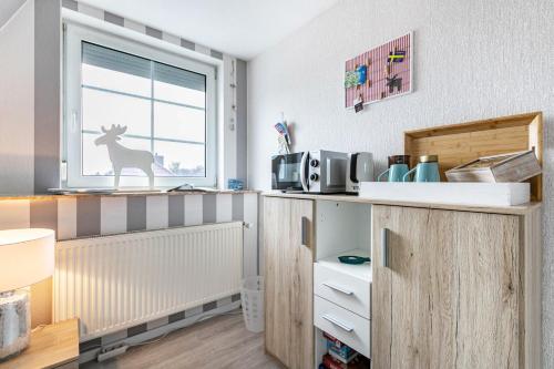Η κουζίνα ή μικρή κουζίνα στο Gästezimmer mitten in Mittelangeln