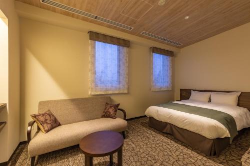 Postel nebo postele na pokoji v ubytování Hotel Grand Vert Kyu Karuizawa