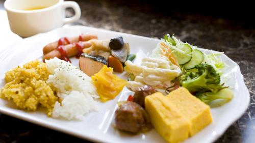 a plate of food with rice and vegetables and a cup of coffee at Toyoko Inn Futamatagawa-eki Kita-guchi in Yokohama