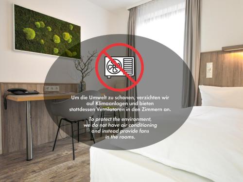 Postel nebo postele na pokoji v ubytování Hotel Perlach Allee by Blattl