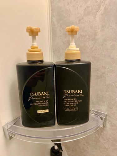 two bottles of soap sitting on a shelf at 晴空民宿 Sora House 晴空塔徒步圈 整栋出租 in Tokyo