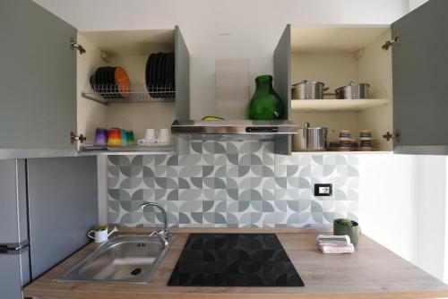 a kitchen with a sink and a counter top at AR apartments in Lamezia Terme