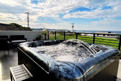 a hot tub with a fountain on top of a balcony at Summer Sale! Luxury Villa Maeda - All Inclusive in Meta