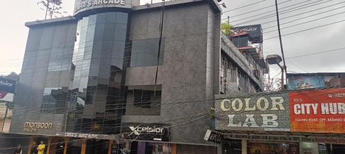 a building with a lot of windows in a city at XCELSIOR HOTEL AND SPA by ROH in Shillong