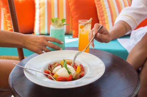 a bowl of food on a table with a plate of food at Juan Rodriguez Hacienda in Athens