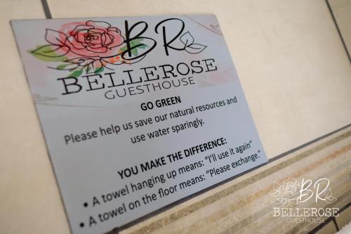 a sign for a beehive flower guesthouse at Bellerose Guesthouse in Klerksdorp