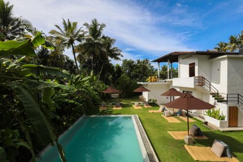 an image of the backyard of a villa with a swimming pool at The Well in Ahangama