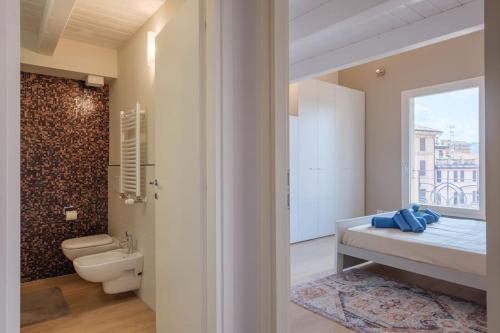 a bathroom with a sink and a toilet and a tub at Luxury Penthouse in the heart of Bologna in Bologna