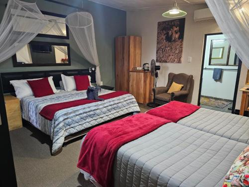Postel nebo postele na pokoji v ubytování Umlilo Guest House