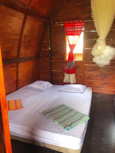 Postel nebo postele na pokoji v ubytování Darma Homestay