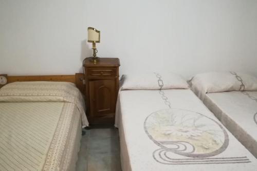 Postel nebo postele na pokoji v ubytování Taverna Albachiara