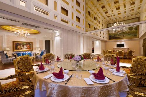 a dining room with a table with hats on it at Sheraton Chongqing Hotel in Chongqing