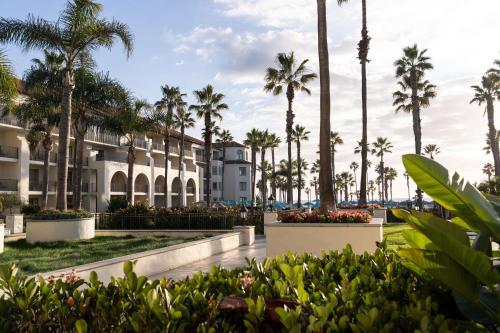 a resort with palm trees and a building at Hyatt Regency Huntington Beach Resort and Spa in Huntington Beach