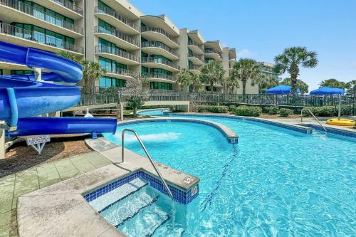 a large swimming pool with a water slide at Phoenix on the Bay 1-1114 in Orange Beach