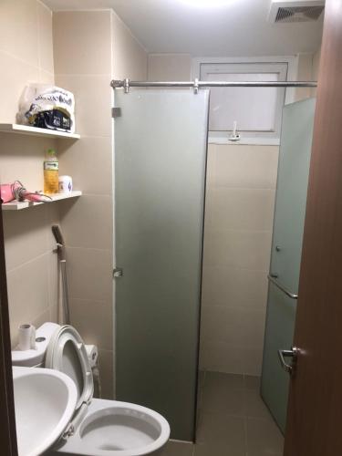 a bathroom with a shower and a toilet and a sink at Happy Apartment-SHP Plaza Lạch Tray in Hai Phong