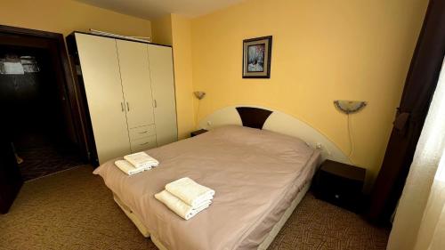 Postel nebo postele na pokoji v ubytování Апартаменти Хармония