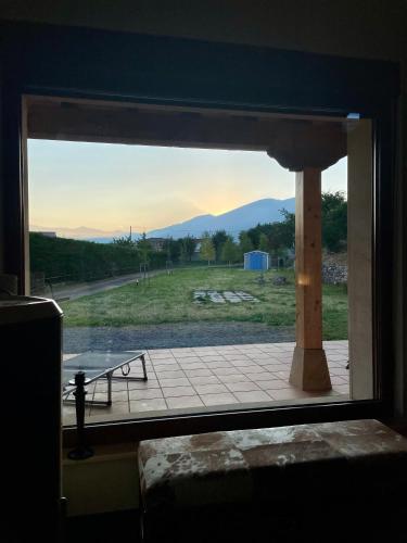 a window in a room with a view of a field at Casa rural en Fontibre in Espinilla
