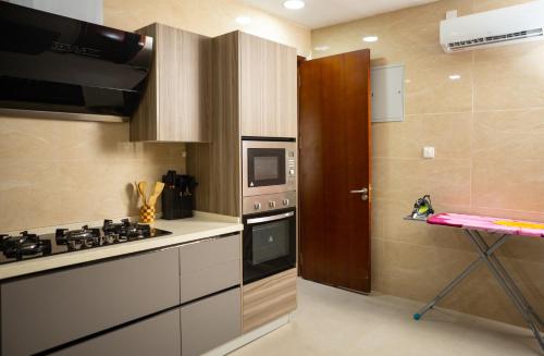 a kitchen with a stove and a stove top oven at Sunflower Residence, Ikoyi in Ikoyi