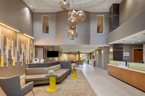 a lobby of a hotel with couches and chairs at SpringHill Suites by Marriott Turlock in Turlock