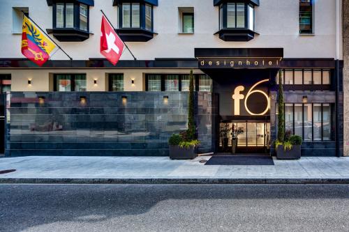 a building with a sign on the front of it at Design Hotel f6 in Geneva