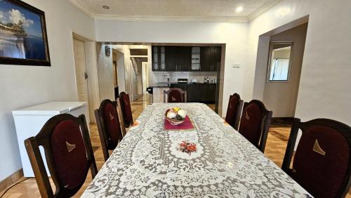 a dining room with a table and chairs at Grey Oak Holiday House in Bulawayo