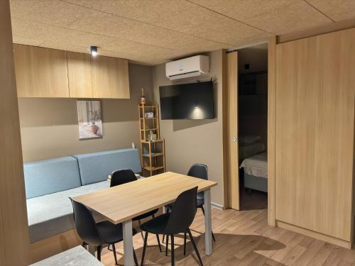a room with a table and chairs and a bed at Holiday Home Ahil 10 in Pakoštane