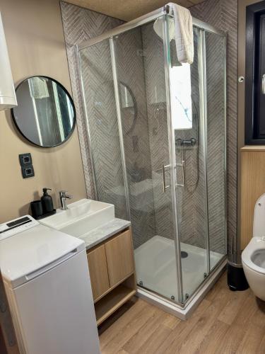 a bathroom with a shower and a sink at Holiday Home Ahil 10 in Pakoštane