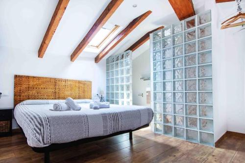 Posteľ alebo postele v izbe v ubytovaní Acogedor Dúplex con terraza interior en la playa
