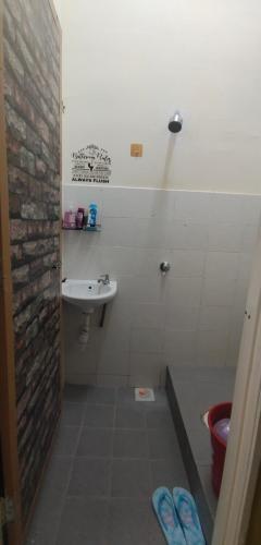 a bathroom with a sink and a toilet at Homestay BRP Bypass 69 in Kuantan