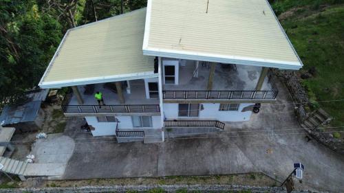a person standing on the porch of a house at Casa De Pueblo complete property units 1&2 in Valencia